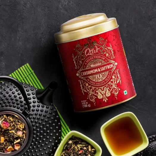 Otler Cardamom and Saffron Tea packaging with a warm, inviting background